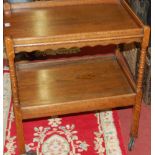 An oak two-tier tea trolley