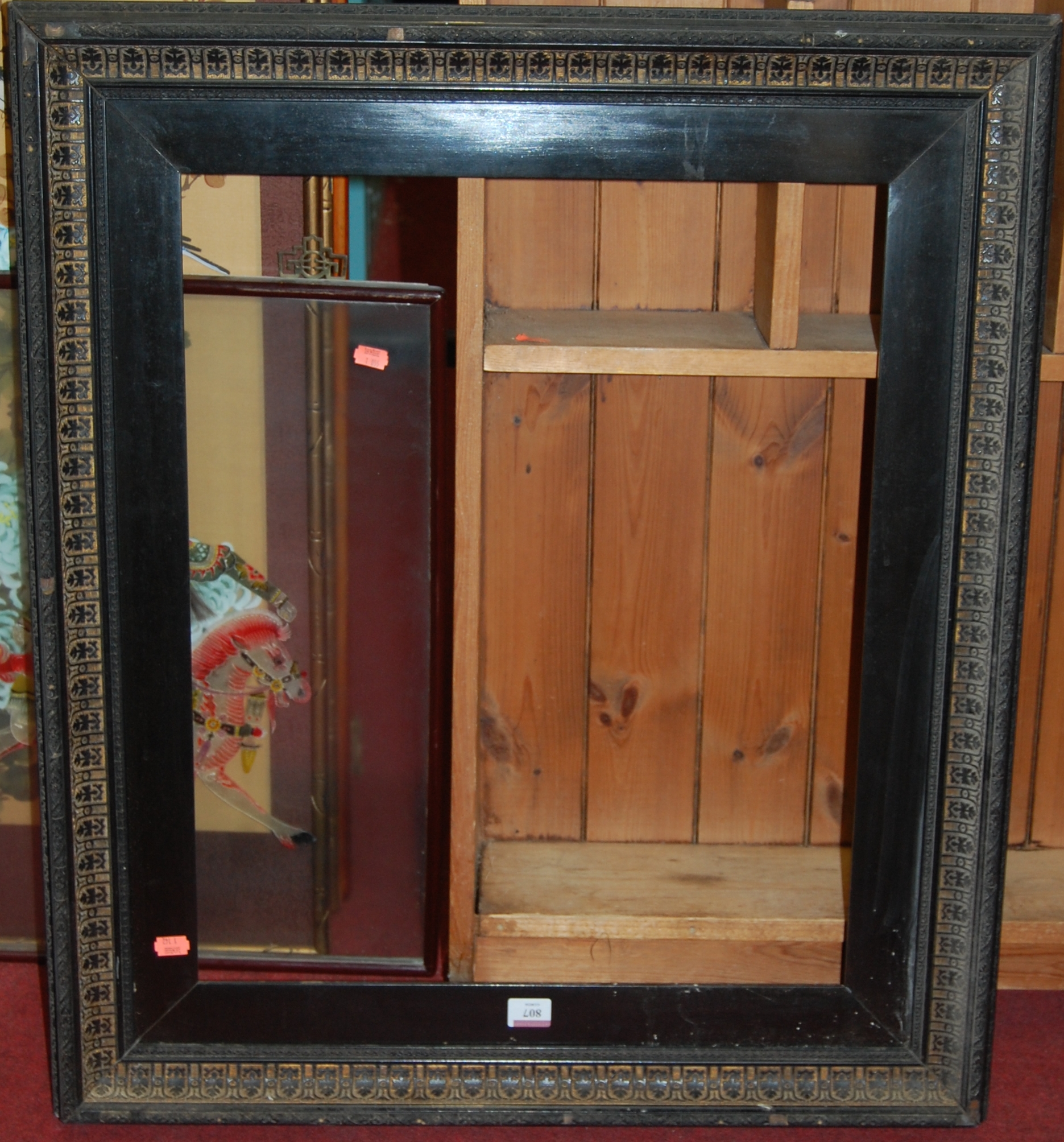 A late Victorian ebonised gesso picture frame, inner slip dimensions 61 x 50.