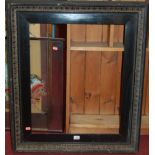 A late Victorian ebonised gesso picture frame, inner slip dimensions 61 x 50.