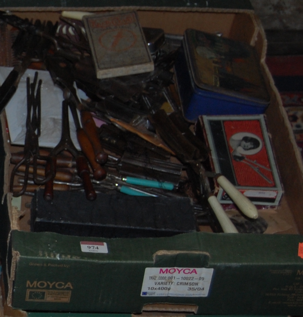 Two boxes of various shoemakers tools,