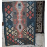 A Persian woollen kilim rug,