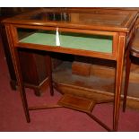 A walnut and satinwood crossbanded hinge top freestanding bijouterie table