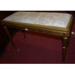 A giltwood upholstered topped duet stool