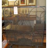 A late Victorian black painted wire work and mesh inset spark guard