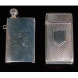 A George V silver striking lighter in the form of a book, bearing the initials CFA,