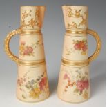 A pair of circa 1900 Royal Worcester blush ivory vases, of tapered cylindrical form,