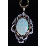 A ladies 14ct gold opal and diamond set pendant,