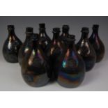 A collection of nine 18th century green glass bladder / onion bottles,