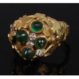 A modern 18ct gold emerald and diamond dress ring,