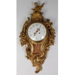 A large late 19th century French gilt bronze cartel clock, having a convex white enamel dial,