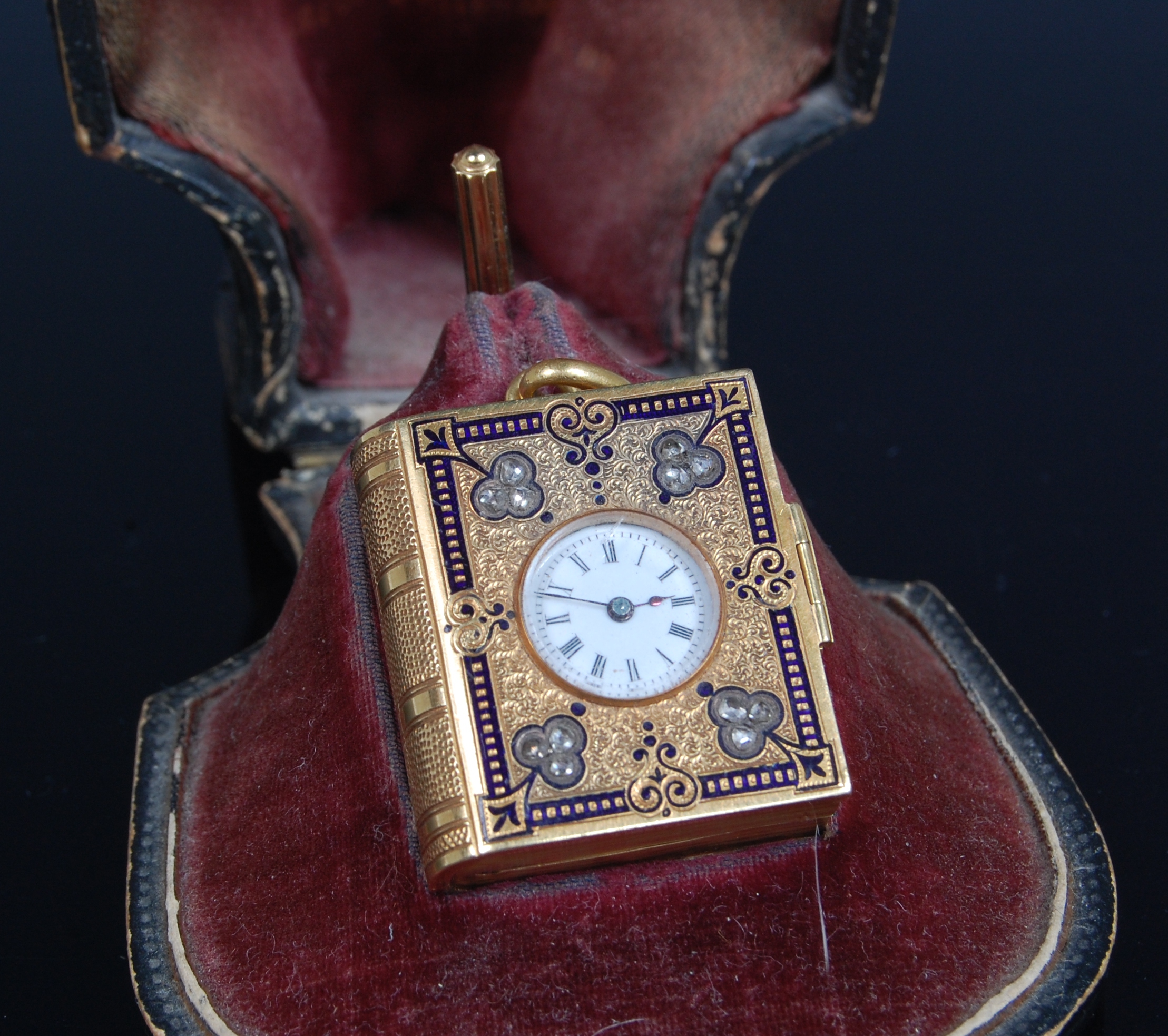 A jewelled gold and enamel watch and picture locket pendant,