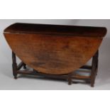 An 18th century provincial joined oak dropleaf dining table,