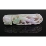 A Chinese carved celadon and amethyst jade belt buckle, of dragon mask and lizard type creature, 8.