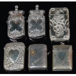 A pair of circa 1900 silver plated crown-top vesta cases,