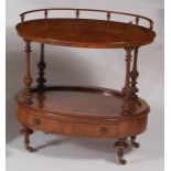 A Victorian figured walnut two-tier whatnot, of oval form with base drawer, w.73cm, d.48cm, h.