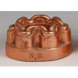 A Victorian copper low ring jelly mould, monogrammed NR with further letter T, h.