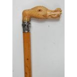 A late Victorian ivory handled and mallacca walking cane, having embossed silver collar,