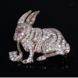 A white metal and diamond set novelty brooch, in the form of a pipe-smoking hare,