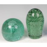 A Victorian green glass dump, having bubble inclusions, h.