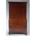 A George III oak chest-on-chest, the upper section having fluted quarter turned pilasters,