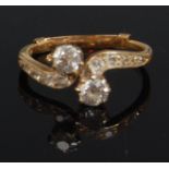 An early 20th century ladies yellow gold diamond set crossover ring,