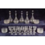 A late Victorian part-suite of glass, comprising; six conical decanters with associated stoppers,
