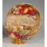 A Royal Worcester porcelain teacup and saucer,