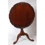 A late 19th century mahogany piecrust topped pedestal tripod table,