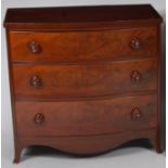 A mid-19th century mahogany, flame mahogany and crossbanded bowfront chest, of three long drawers,