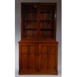A Victorian mahogany bookcase cabinet, having glazed upper section enclosing adjustable shelves,