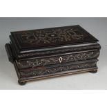 A late 19th century Indian hardwood and floral ivory inlaid hinge-top sewing box,