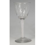 A mid-18th century pedestal goblet, having double opaque airtwist stem to a conical foot, h.
