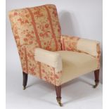 An Edwardian mahogany framed and floral upholstered open armchair,