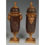 A pair of Louis XVI style gilt bronze and variegated marble cassolette and covers,