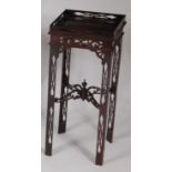 A late 19th century mahogany fret carved lamp table, having a full gallery, united by X-stretcher,