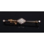 An early 20th century yellow metal and diamond set knife-edge bar brooch,