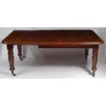 A late Victorian mahogany round cornered extending dining table, having pull-out action,