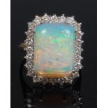 A ladies 18ct gold opal and diamond dress ring,