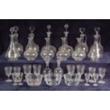 A late Victorian part-suite of glass, comprising; seven ewers (4 with stoppers),