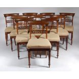 A set of ten William IV rosewood barback dining chairs, each having fret carved centre rails,