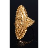 A Middle Eastern 22ct gold ring, of pierced and embossed elliptical form,