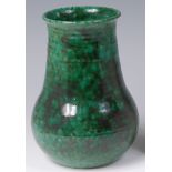 A Ruskin pottery mottled green glazed vase, of ribbed lower bulbous form, with slightly averted rim,