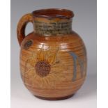 A Martin Brothers glazed stoneware single handled jug, of ribbed bulbous form,