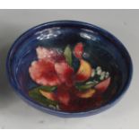 A mid-20th century Moorcroft pottery circular table bowl, having a raised top rim,