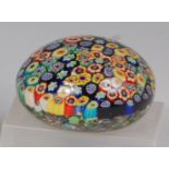 A millefiori close pack caned glass paperweight, unsigned, dia.