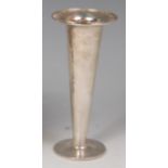 An Art Nouveau silver trumpet form vase by Liberty & Co, having an all-over hammered exterior,