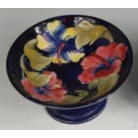 A mid-20th century Moorcroft Anemone pattern pottery footed comport, of typical circular form,