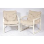 A pair of 1960s white painted buttonback and seat upholstered open armchairs,