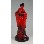 A Royal Doulton flambe glazed figure of a Geisha, HN3229, modelled by T.