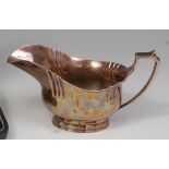 An Art Deco silver sauceboat, having angular handle, fluted detail,